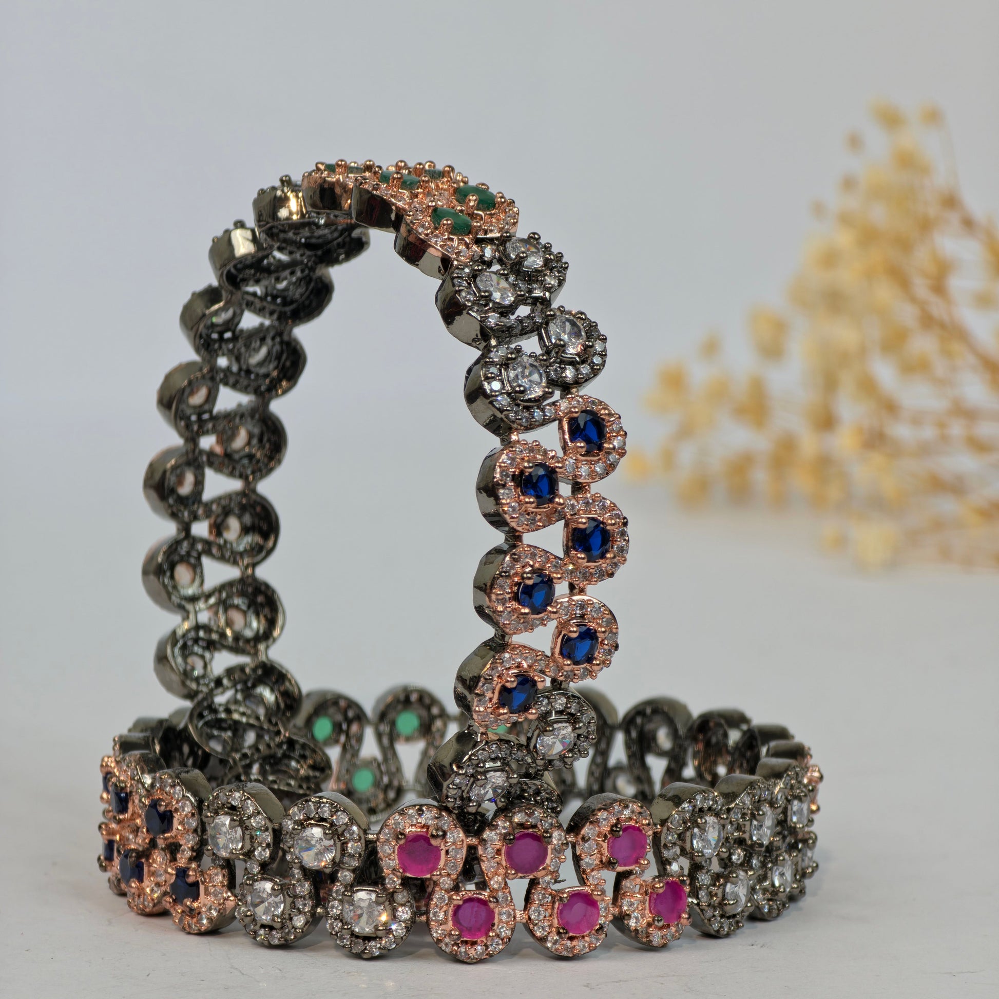 Set of diamond-encrusted bracelets on a light background