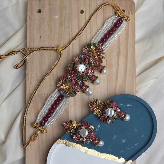 necklace  gemstones on a wooden board with earings