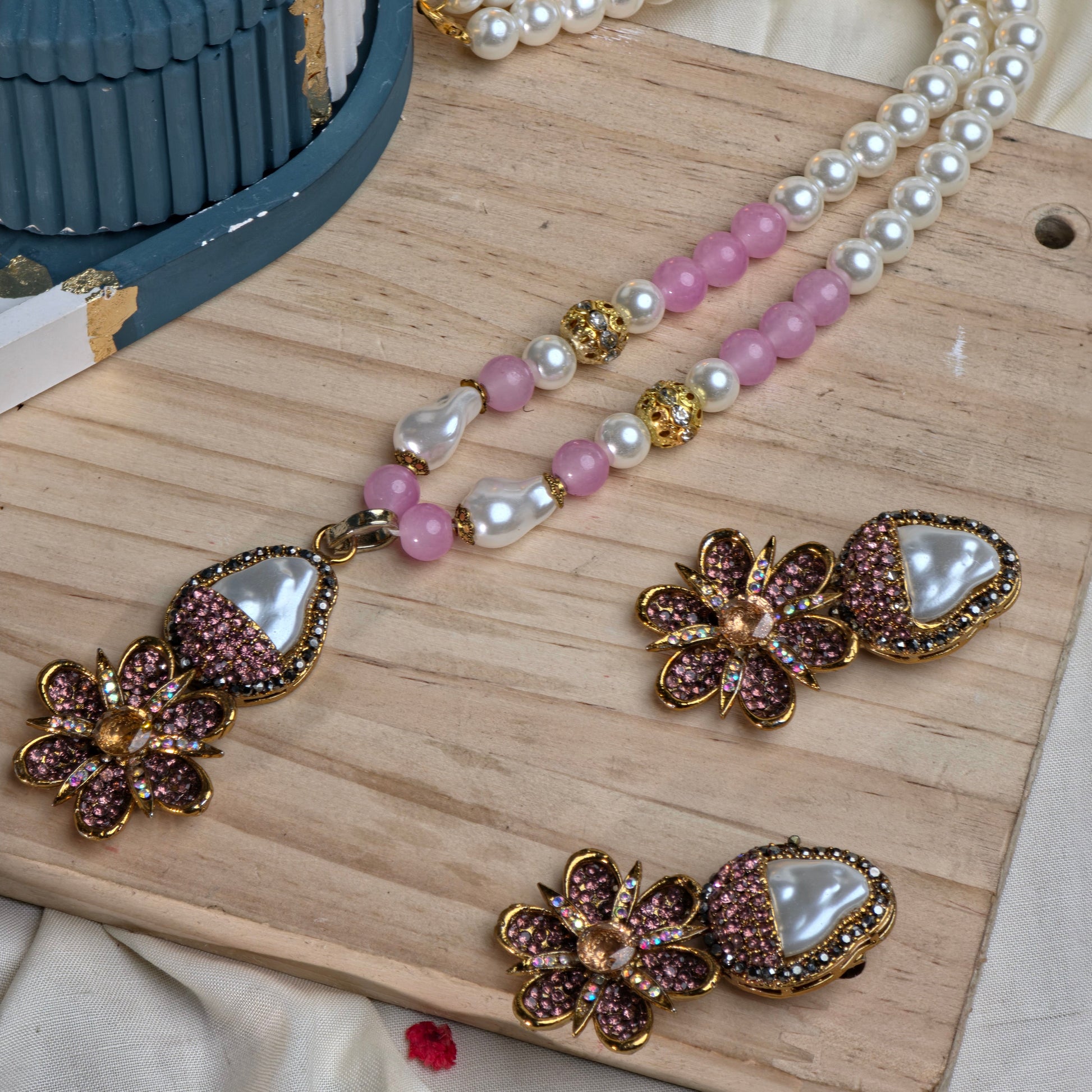 A full view of the handcrafted Royal Floral Mala Set in baby pink, displaying the detailed moti work and floral design elements.