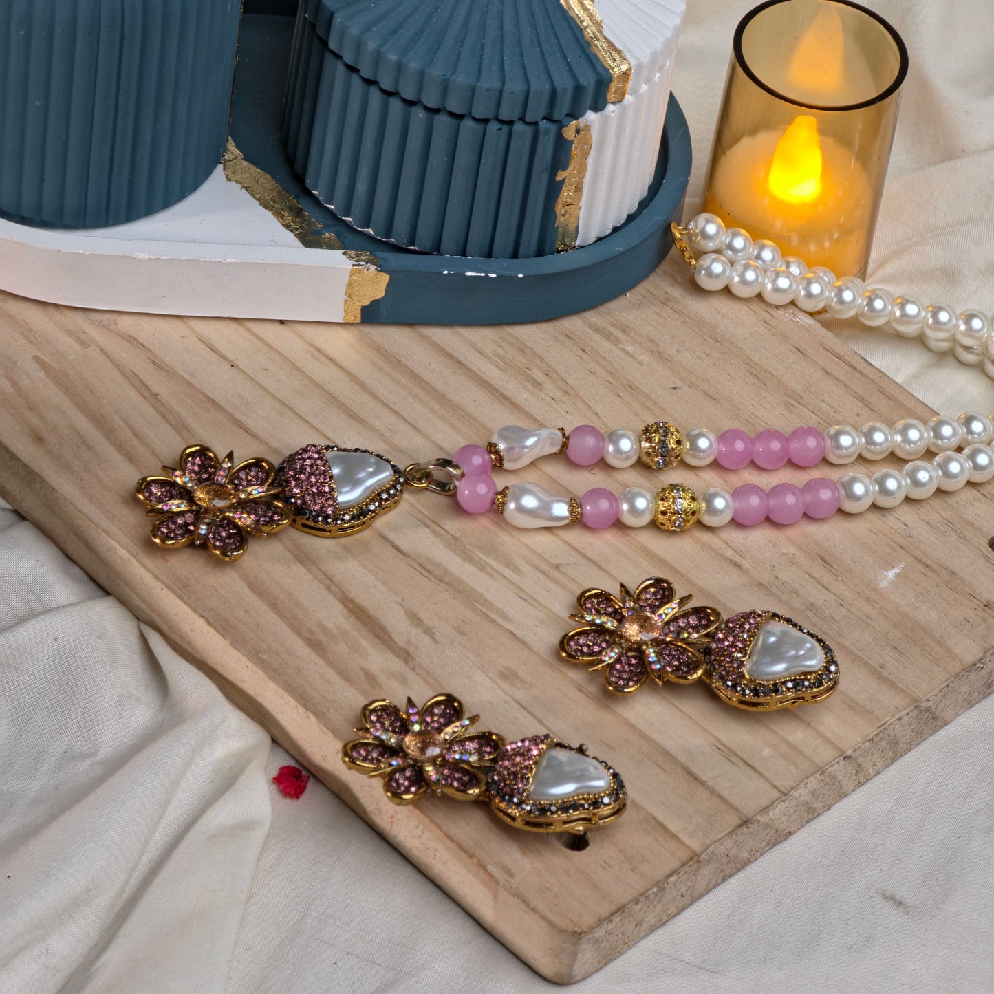 A model wearing the baby pink Royal Floral Mala Set, showcasing how the handcrafted jewelry drapes gracefully.